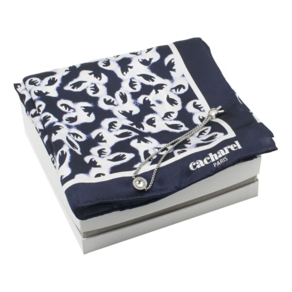 Navy and white patterned Cacharel scarf with a silver bracelet on a white box.