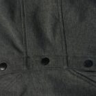 Close-up of dark gray fabric with seams and three black snap buttons.