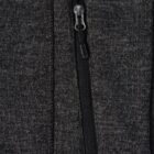 Close-up of a black zipper pocket on dark gray fabric.