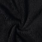 Close-up of black, soft, textured fleece fabric with a slight twist in the center.