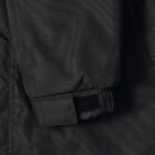 Close-up of a black jacket sleeve with a Velcro strap at the cuff.