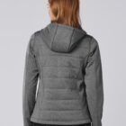 Woman wearing a gray hooded jacket, shown from the back against a plain background.