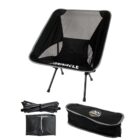 Black foldable camping chair with carrying bag and disassembled frame beside it.
