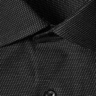 Close-up of a black dress shirt with a small white checkered pattern and a black button.