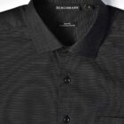 Black slim-fit dress shirt with tiny white dots and a collar, labeled BENCHMARK.