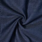 Dark blue fabric with small white dots, gathered in a spiral pattern at the center.