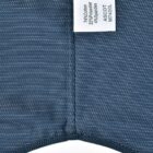 Blue fabric with a label showing fabric composition and style name ASCOT M740L.