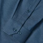 Close-up of a blue dress shirt sleeve with small white dots and buttoned cuff.