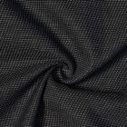 Black fabric with small white dotted lines and a swirling, twisted texture in the center.