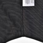 Dark, pinstriped fabric with a white garment label showing material composition.