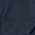 Close-up of dark blue fabric with a subtle dotted texture and a folded corner.