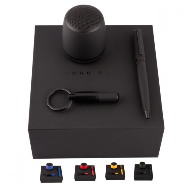 Black gift set with speaker, pen, keychain on a box, and four color accent options shown.