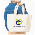 Person in denim jacket holding a beige tote bag to showcase your business goals and brand.