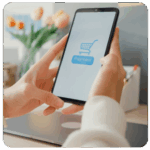 A person holding a phone with a payment screen, shopping cart, and business goals in mind.