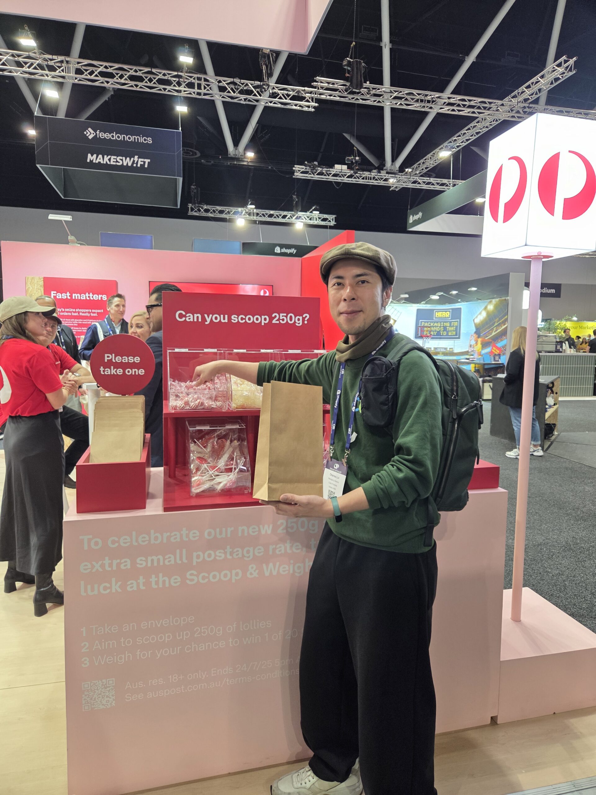 Man scooping lollies at Scoop & Weigh booth during Online Retailer Conference Sydney 2025.