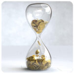 Hourglass filled with gold coins, symbolizing time and business goals flowing to success.