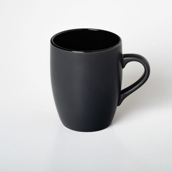 A plain black Caribbean Mug with a handle sits against a white background.