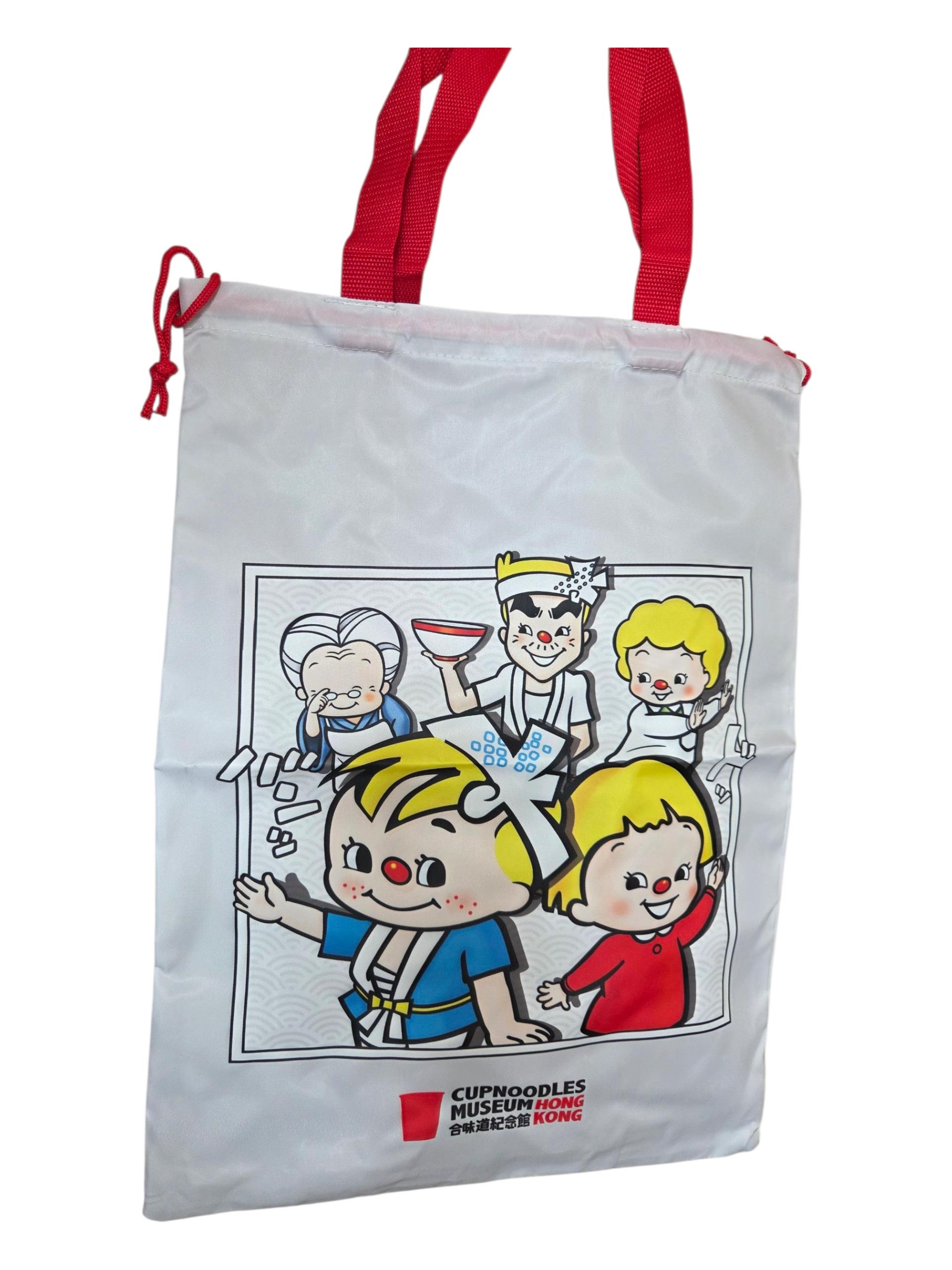 White tote bag with cartoon characters, red handles, and custom merchandise from CupNoodles Museum Hong Kong.
