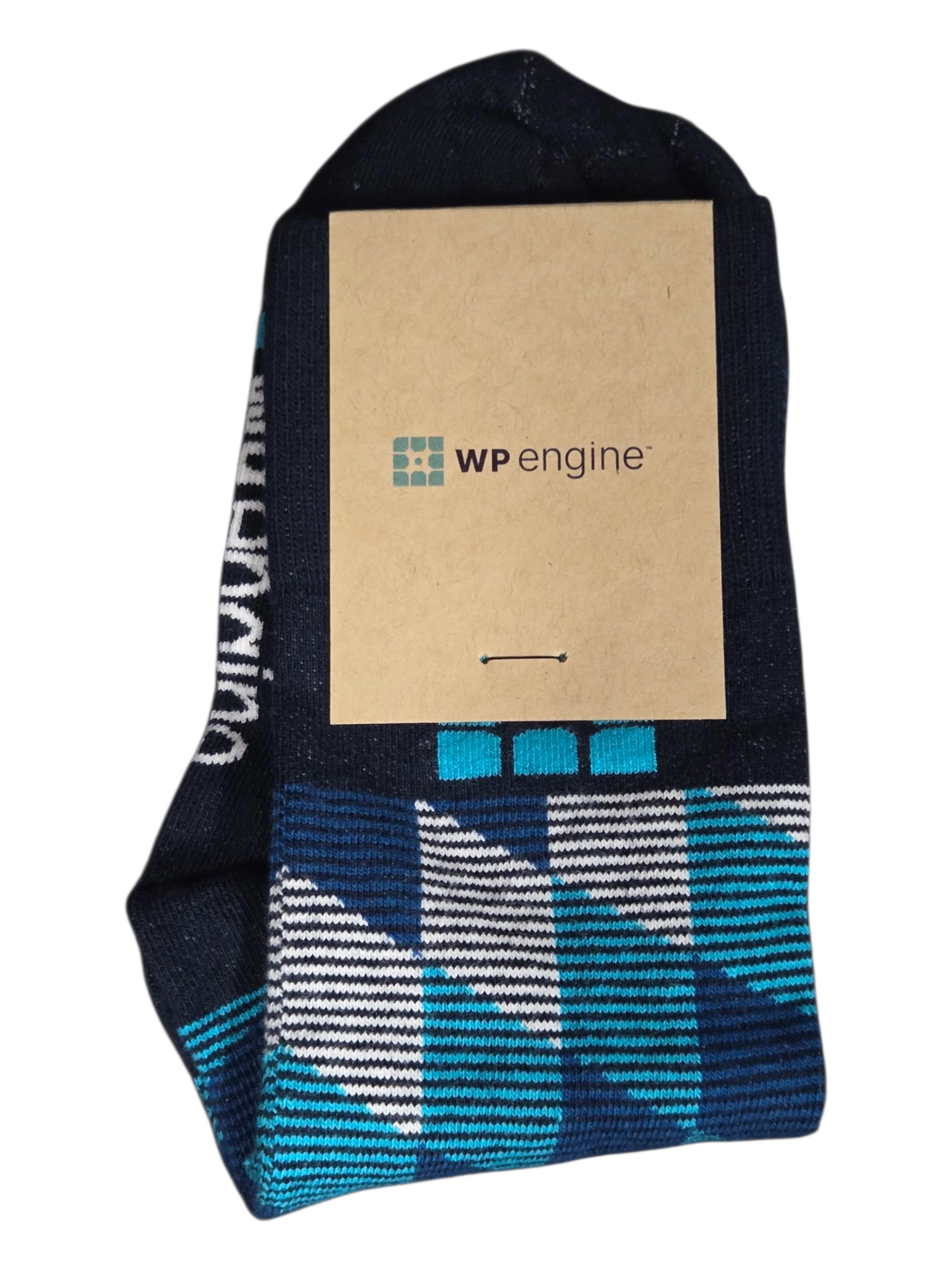 A pair of navy socks with a WP Engine tag, perfect as stylish conference items.