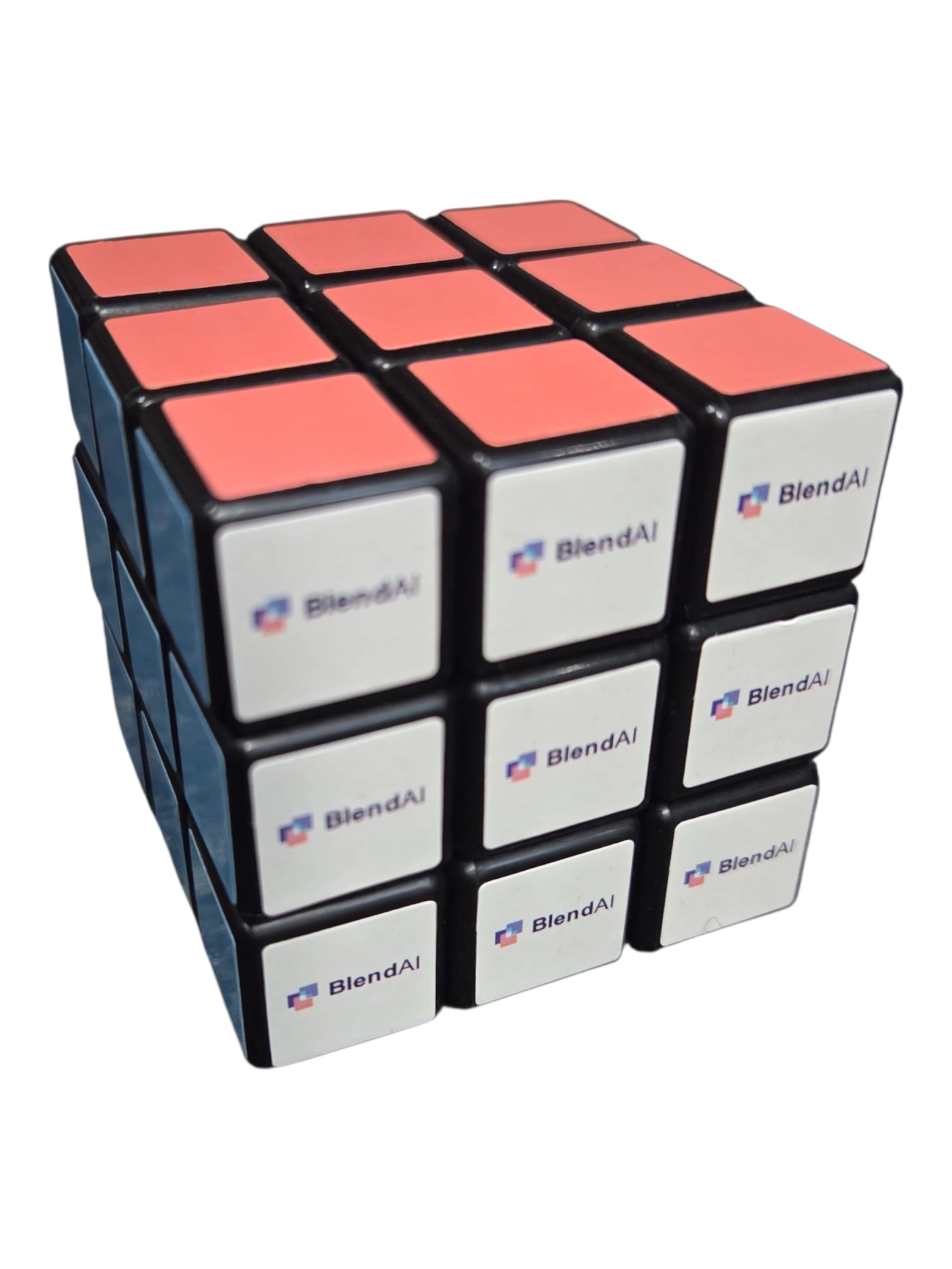 A Rubik’s cube with BlendAI logos, pink squares, and a 2025 Show Report theme on top.