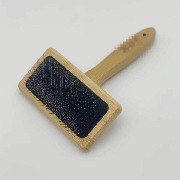 Deshedding Brush for Cats & Puppies with rectangular wood handle and metal bristles.