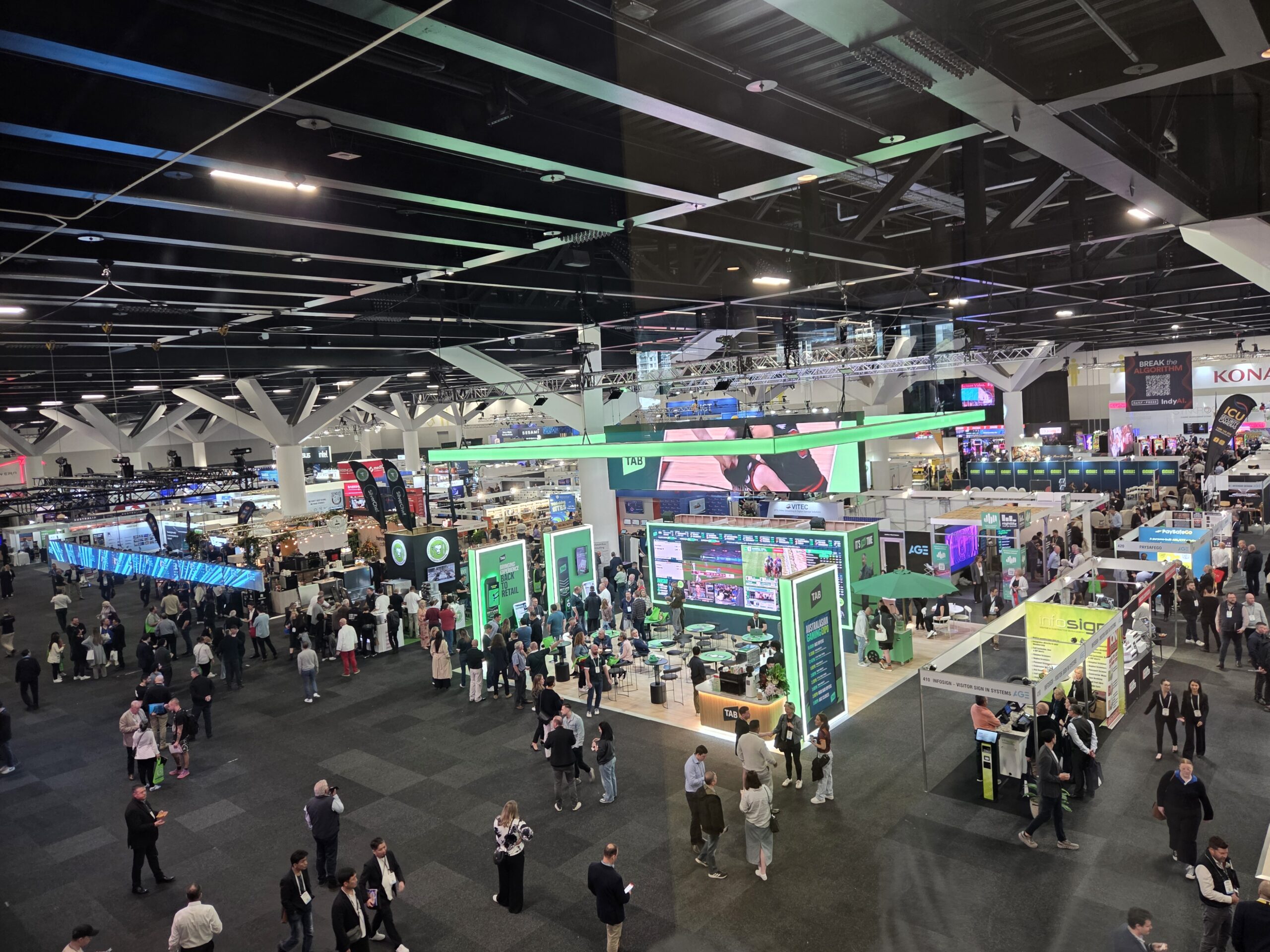 Day 1 of the 2025 Australian Gaming Expo: a bustling hall with booths, crowds, and vibrant displays.