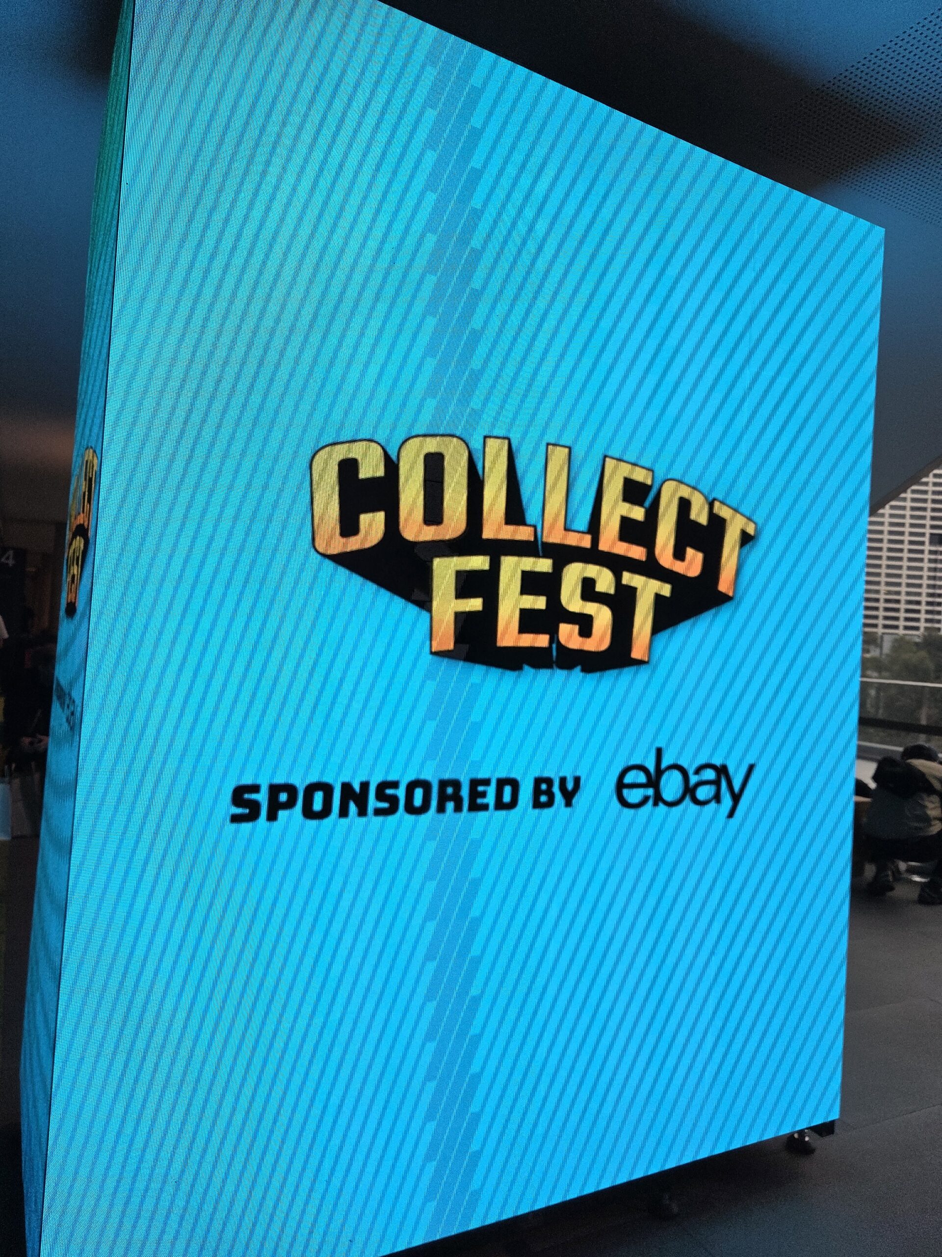 Large digital sign reads Collect Fest Sponsored by eBay at Collectfest Sydney 2025 indoors.