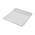 Folded gray and white striped towel for The First Impressions Hampers on a white background.