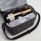 A bottle of Chandon and a folded towel in The Executive Celebration Hampers cooler bag.