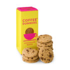 A yellow and pink The Morning Meeting Hampers box beside chocolate chip cookies.