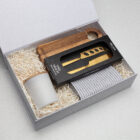 The Business Graze Sets: Gift box with candle, cheese knives, board & striped towel on shred paper.