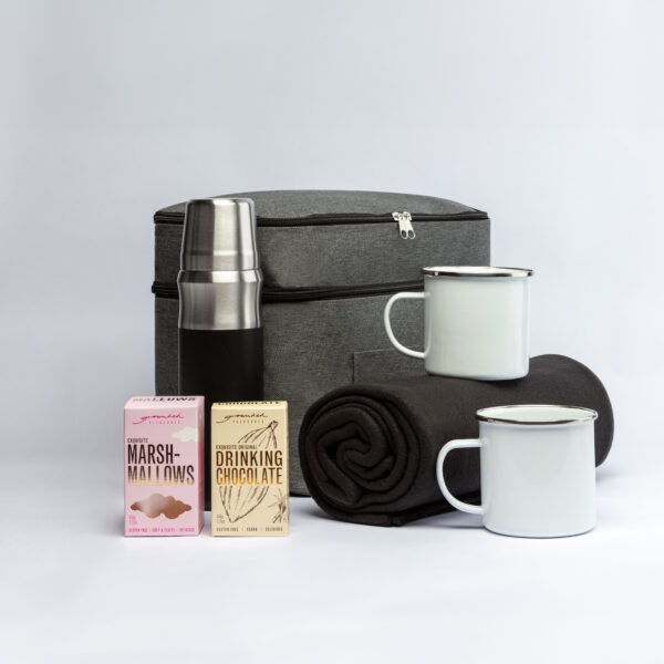 The Corporate Comfort Collection: picnic set with thermos, mugs, blanket, snacks, and gray bag.