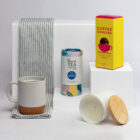 The Morning Ritual Hamper: Includes mug, tea, chocolate, candle, and a striped towel.
