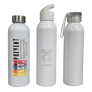 Three white aluminium bottles, each with a unique cap and design, standing side by side.