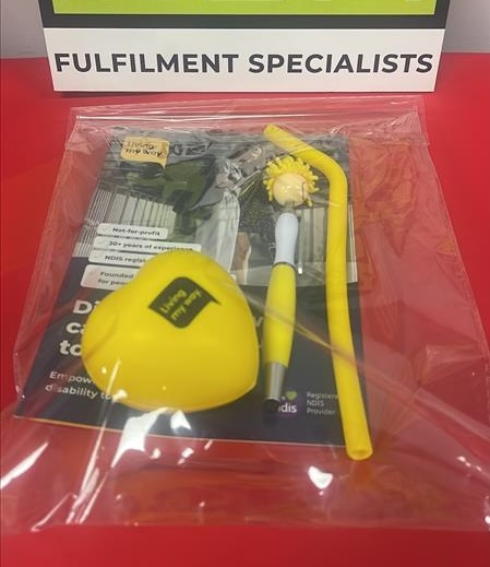A clear bag with yellow items for Not-for-Profit Organisations on a red surface.