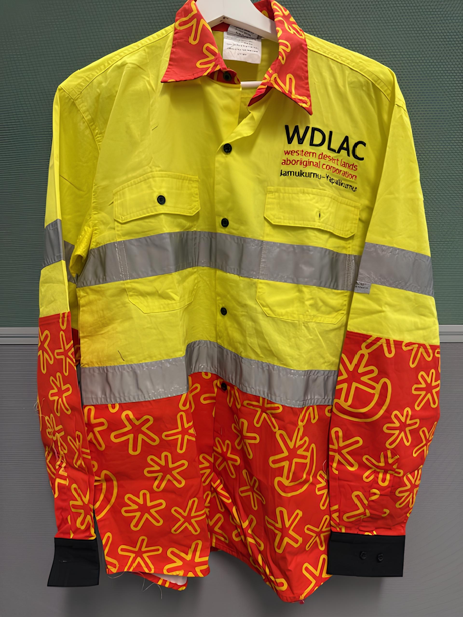 High-visibility shirt with yellow, red, and reflective bands; WD LAC logo on chest.
