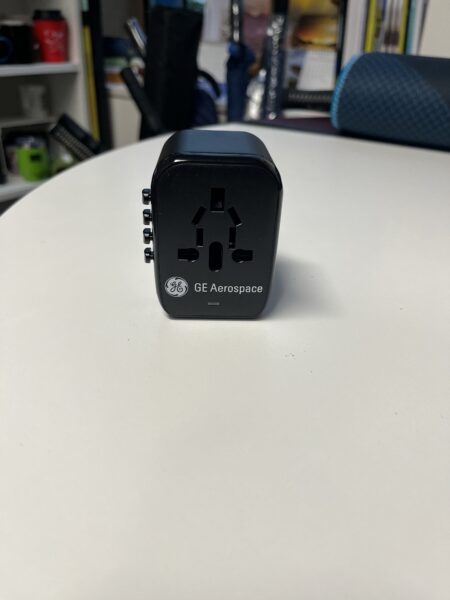 A GE Aerospace universal travel adapter