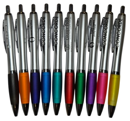 Ten plastic pens with colored grips in a row, ideal for comparing plastic pens vs metal pens.
