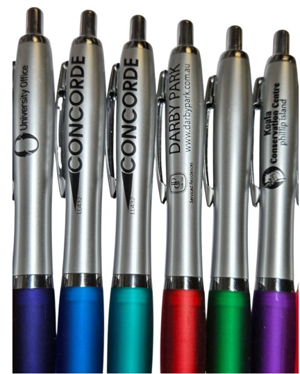 Six silver plastic pens with colored grips, perfect for comparing plastic pens vs metal pens.