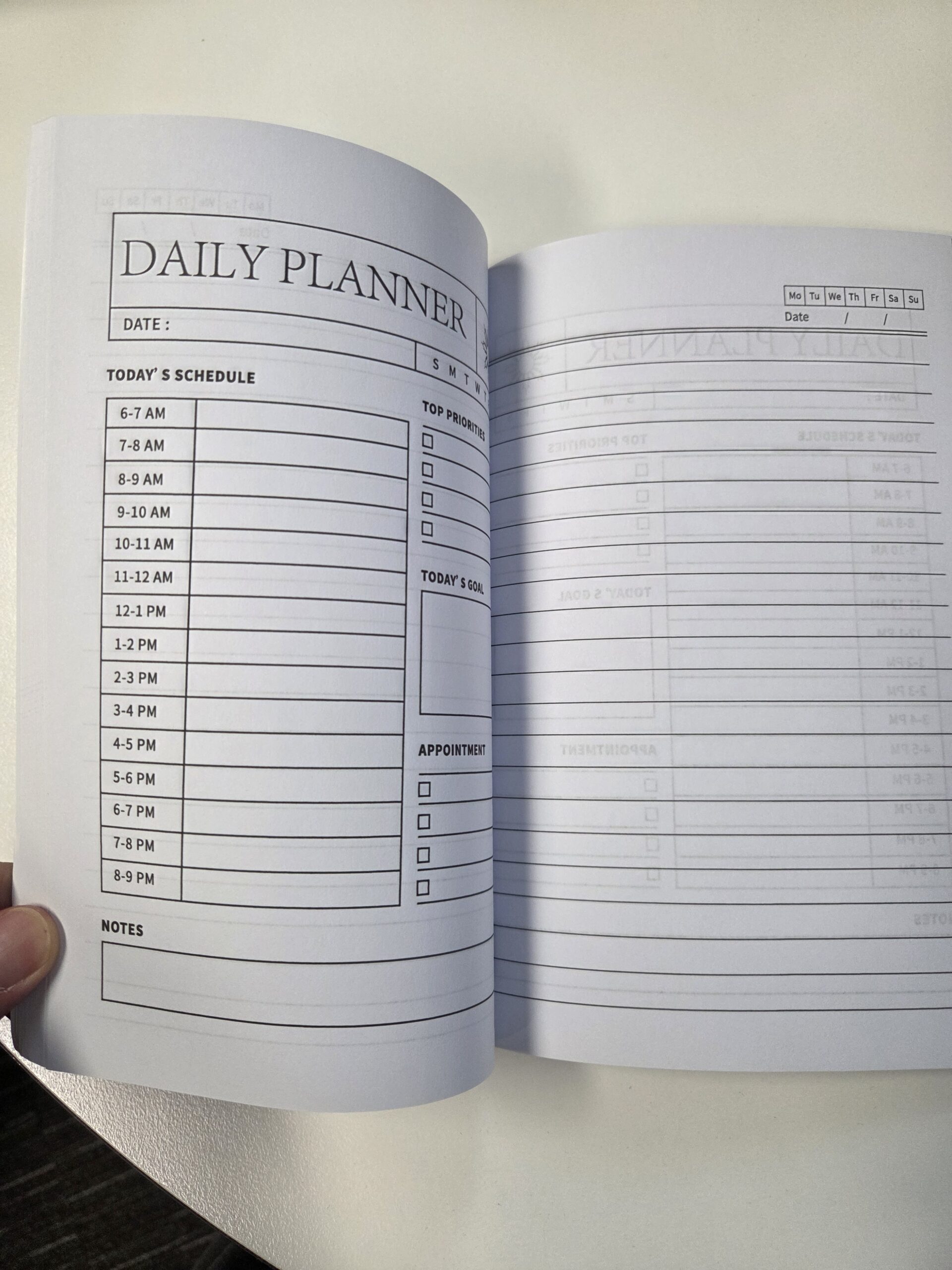 Open daily planner with priorities, goals, and notes—great for any buying guide for diaries.