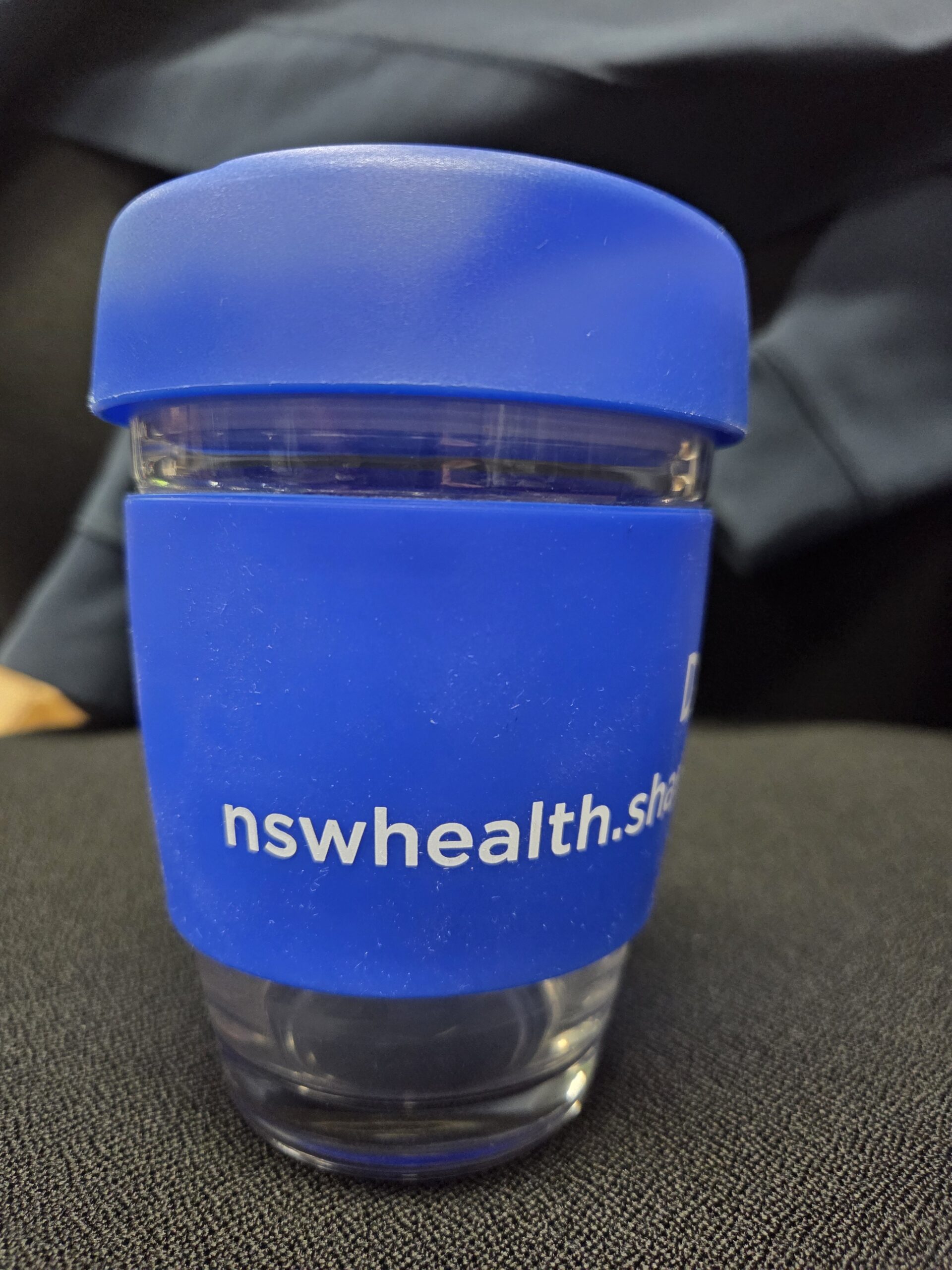 side view of the reusable cup with blue lid