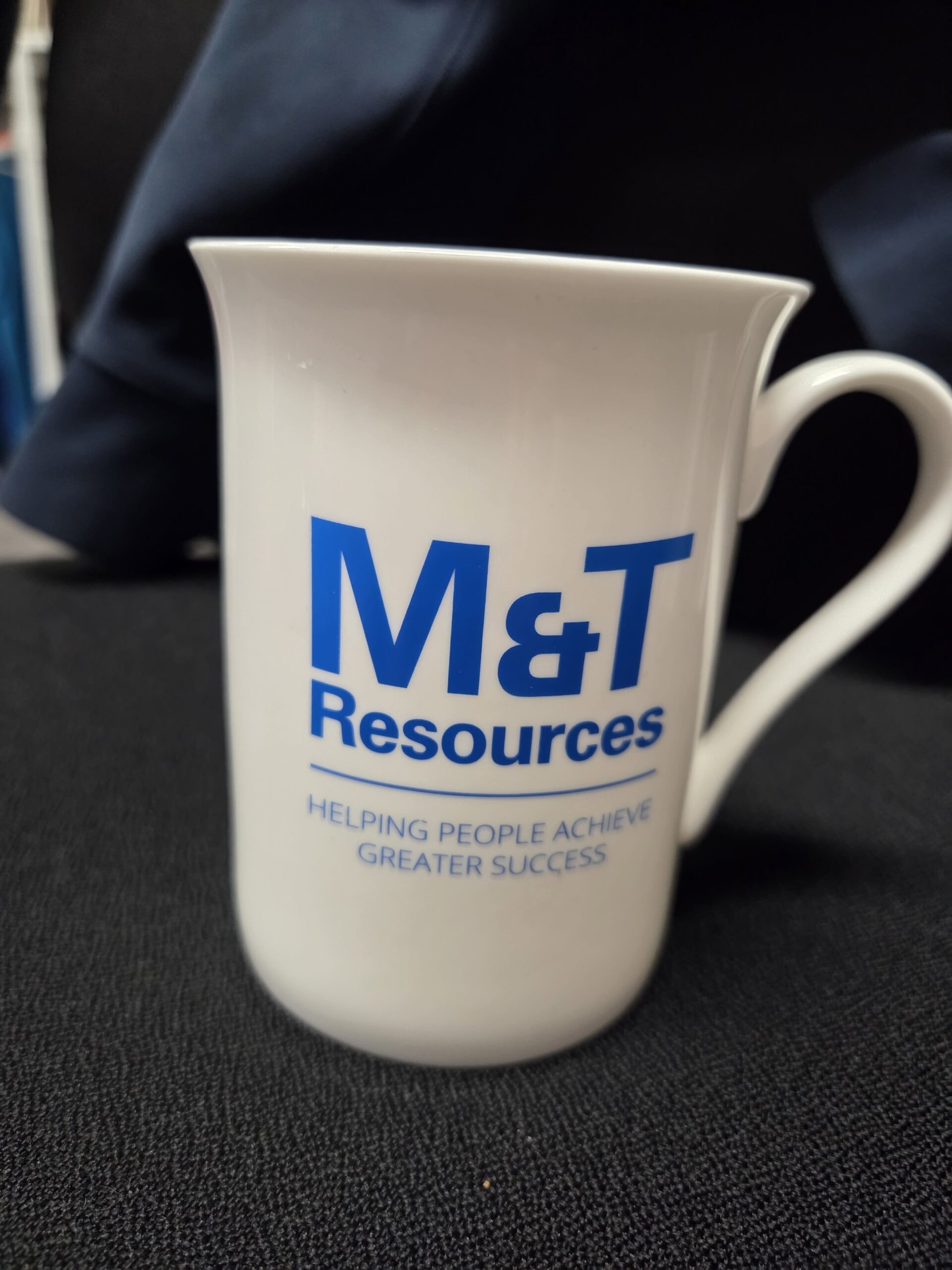 white mug with M&T Resources logo