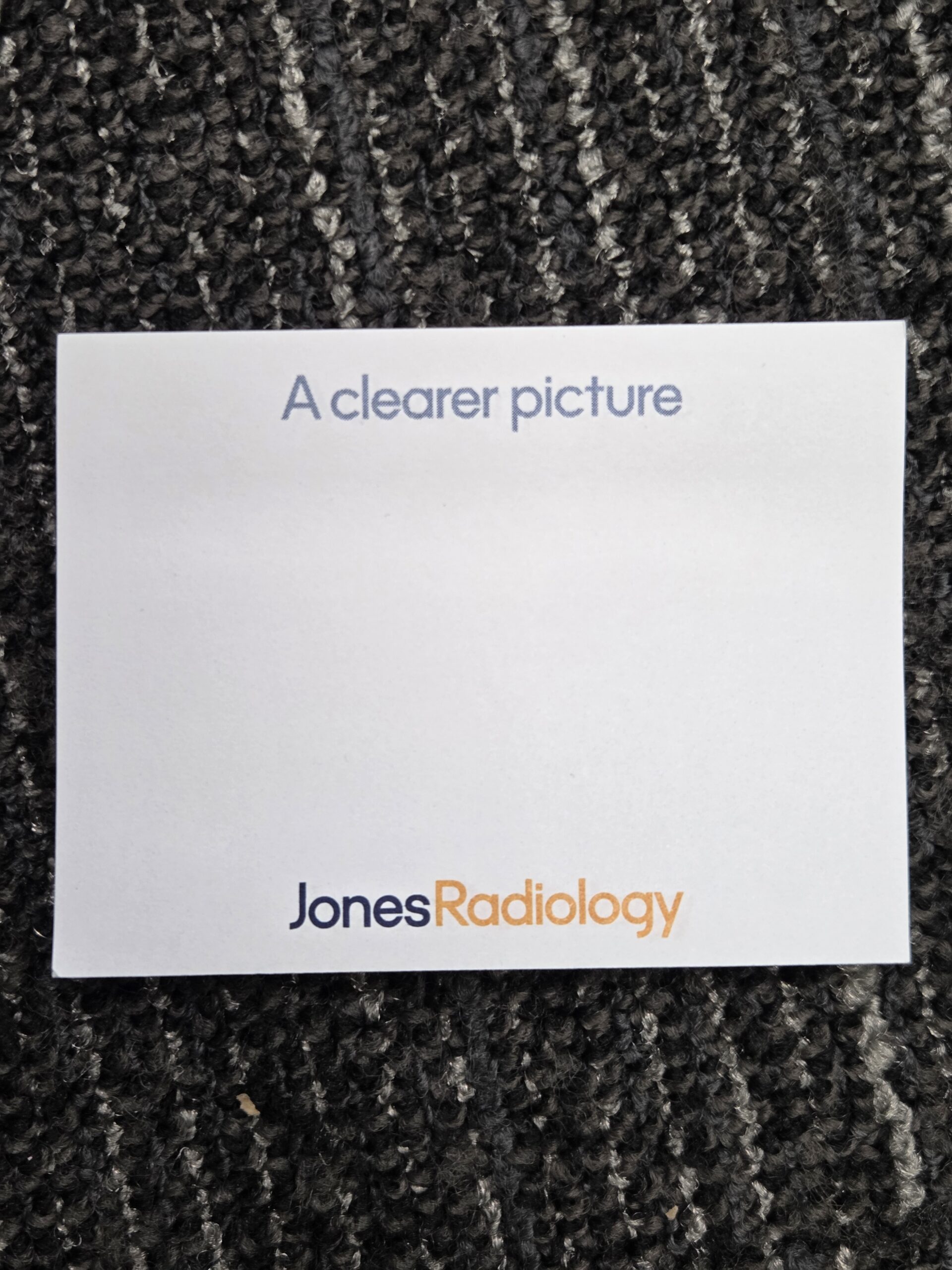 sticky notes with text above and logo of Jones Radiology at the bottom