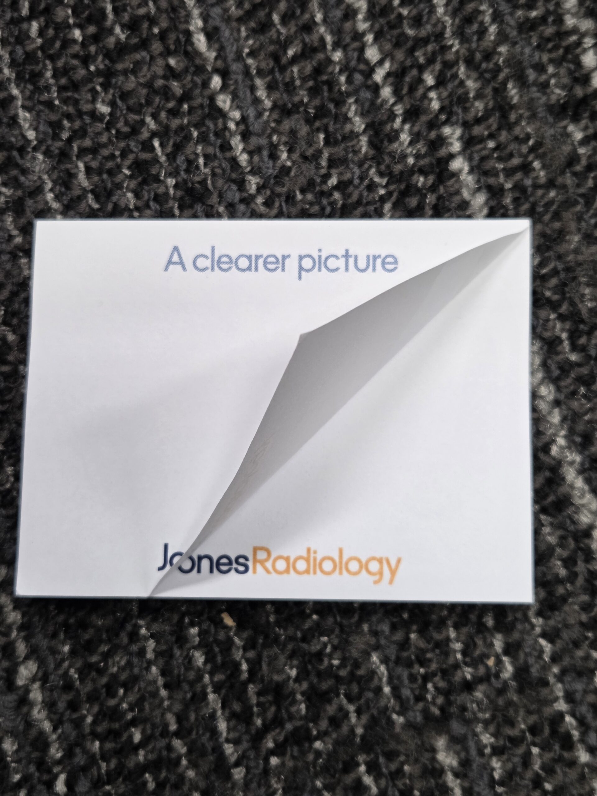 sticky notes with text above and JonesRadiology logo at the bottom and a fold