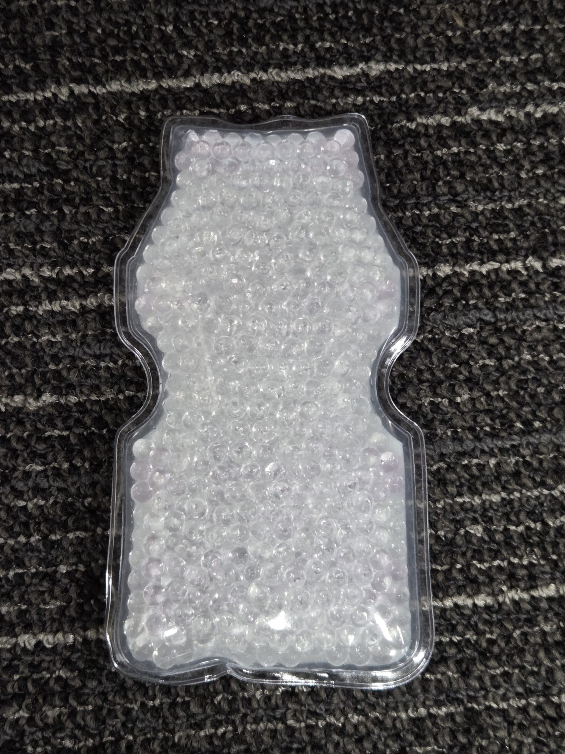 back view of the ehat pack shaped as a yakult bottle