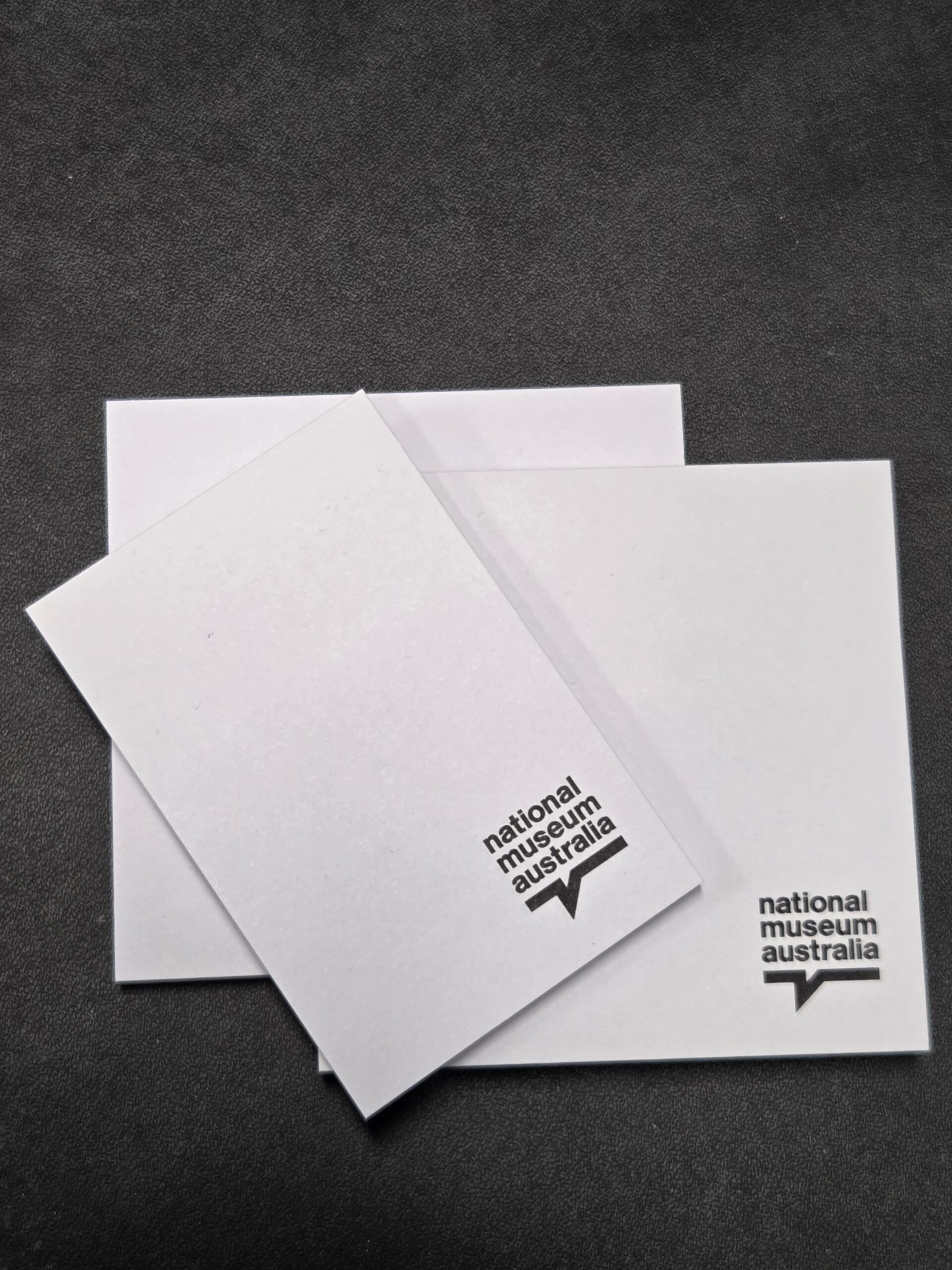 3 white notepads with national museum australia logo