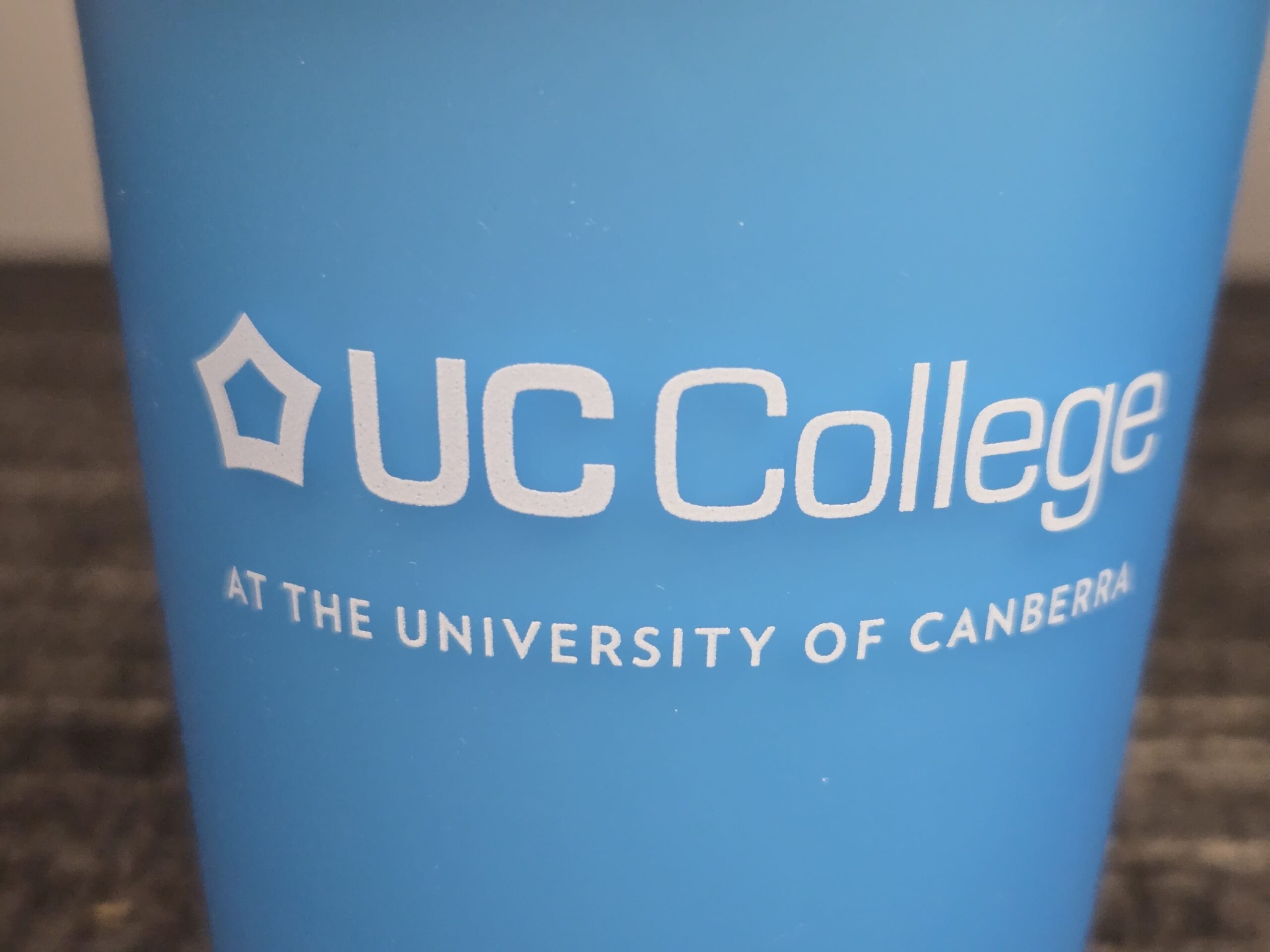 closer view of the UC college logo print on the cup