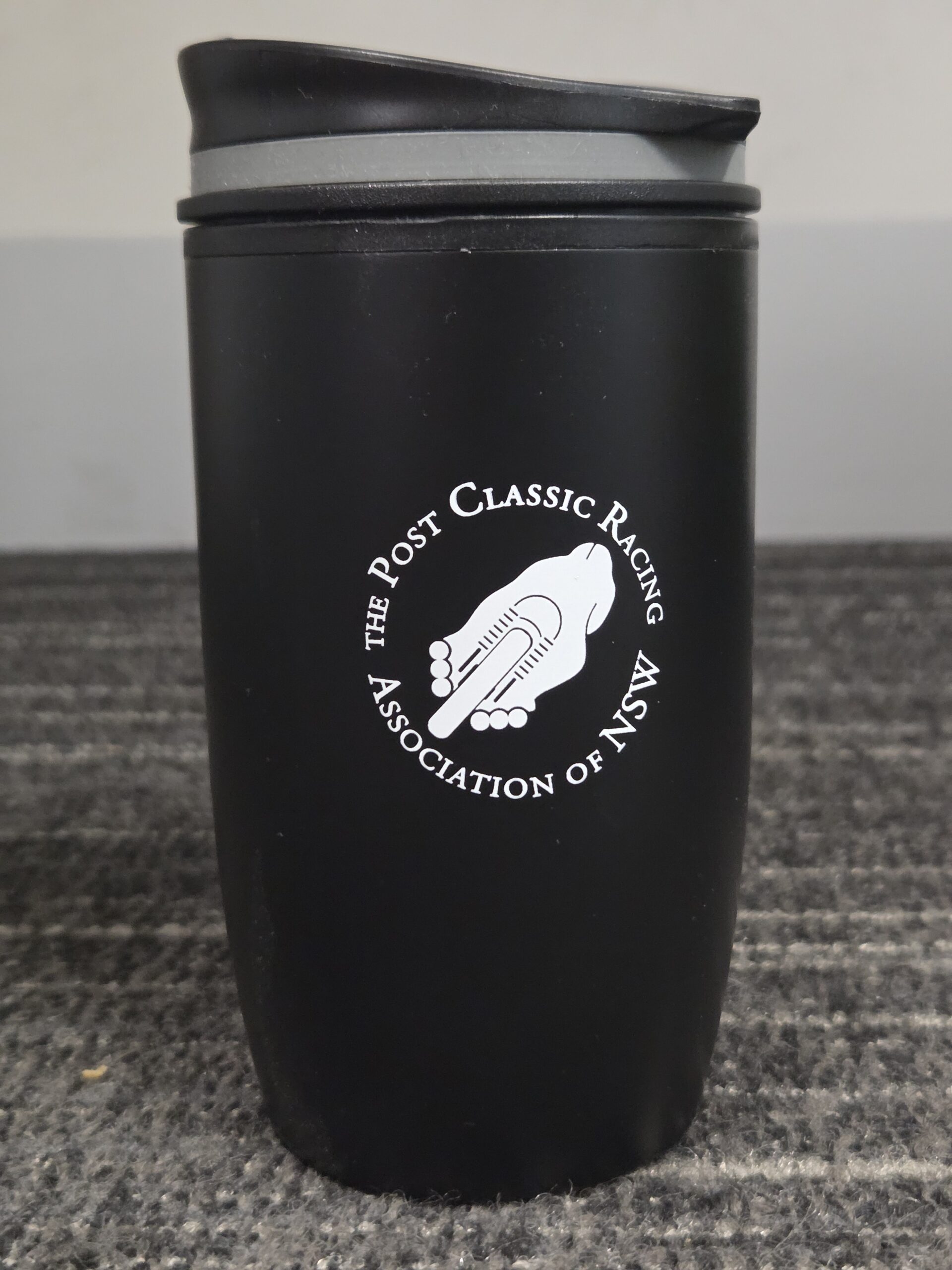 black travel mug with lid and Post Classic Racing Association of NSW printed