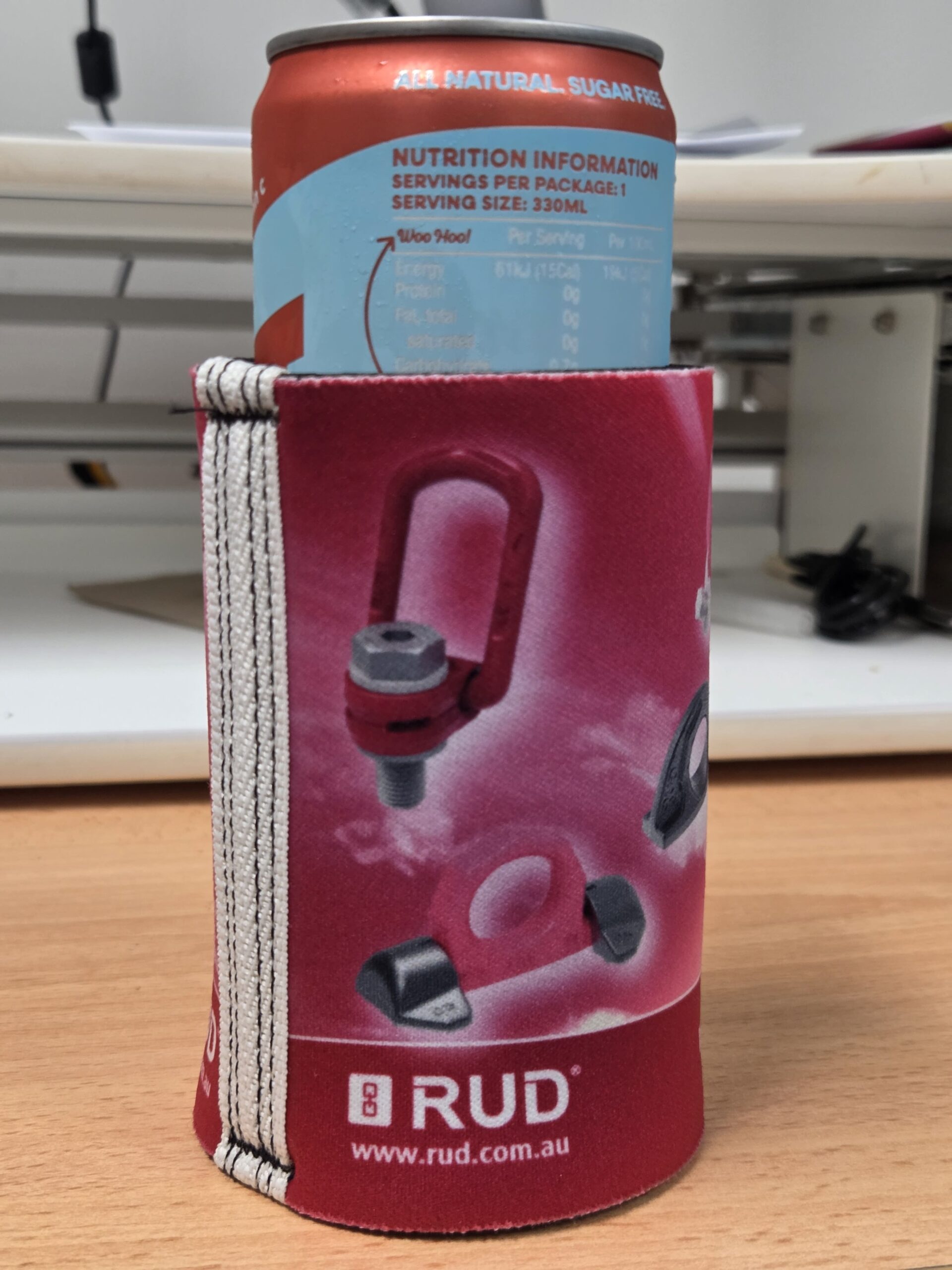 red stubby cooler with RUD logo and link