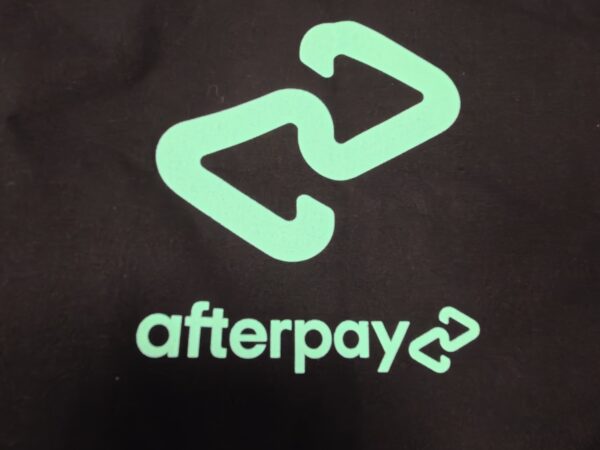 Afterpay logo in teal on a black background, perfect for Calico Cotton Bags branding.